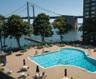 Community pool featuring a patio and a water view
