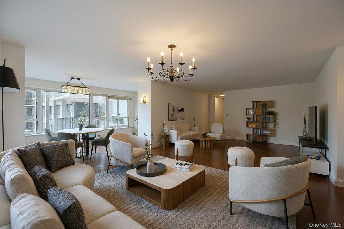 Living room featuring a chandelier and wood finished floors
