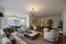 Living room featuring a chandelier and wood finished floors