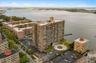 View of urban area with a large body of water and apartment complex / building