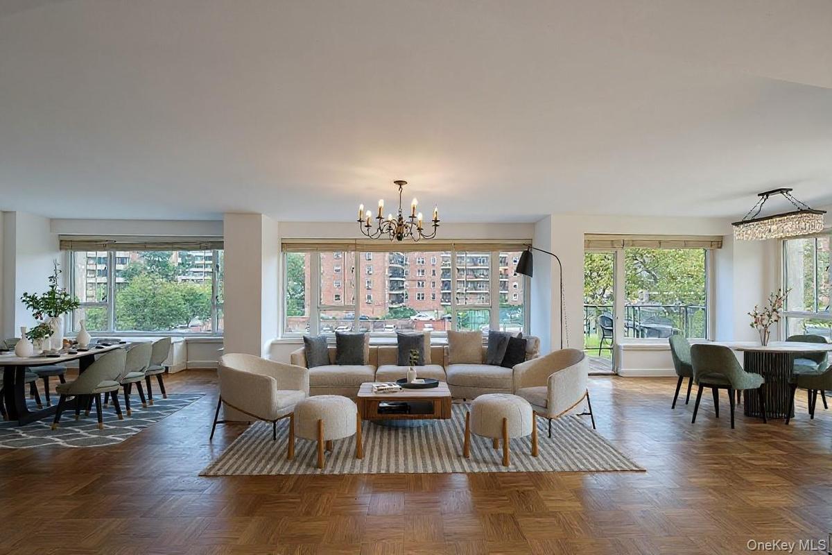 Living room featuring a chandelier and plenty of natural light