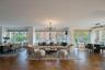Living room featuring a chandelier and plenty of natural light