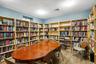 Living area featuring wall of books