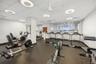 Workout area featuring a drop ceiling