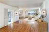 Living room featuring light wood-style floors and ornamental molding