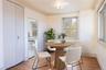 Dining room featuring light wood finished floors and ornamental molding