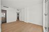 Unfurnished bedroom with light wood-style floors, ensuite bath, and recessed lighting
