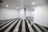 Empty room with baseboards and recessed lighting