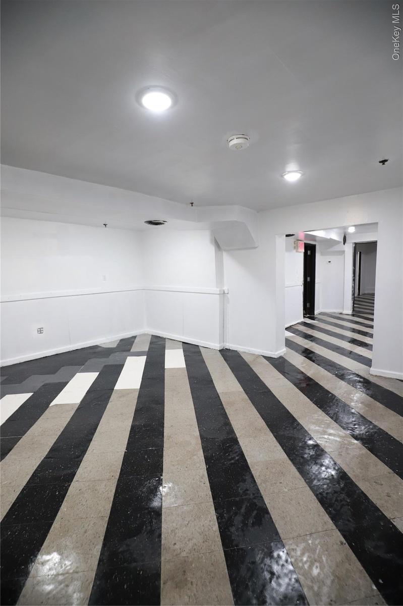 Spare room featuring baseboards