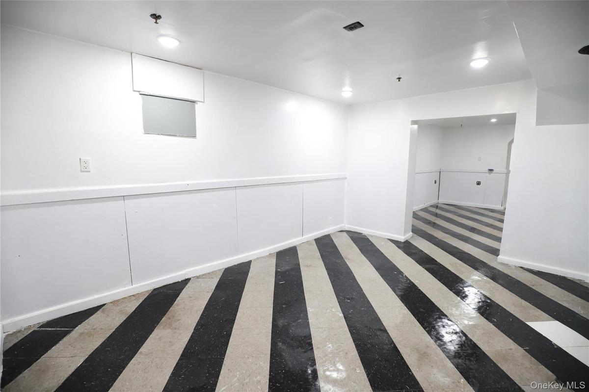 Unfurnished room with baseboards