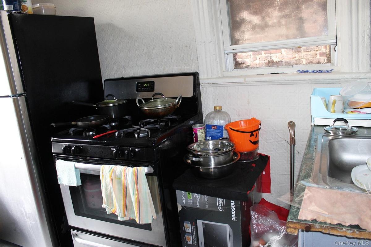 Kitchen featuring stainless steel range with gas stovetop