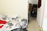 Bedroom with light tile patterned floors
