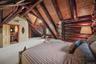 Bedroom with private bath and views of the property on two sides of the room