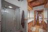 Primary bath - large shower and dual vanity areas with storage; private WC
