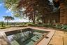 Doors from primary suite open to large, in-ground salt water spa