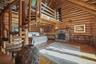 First floor extensive primary suite with woodturning fireplace, walk-in closets and loft accessed by a charming spiral staircase