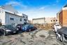 Uncovered parking lot with a residential view