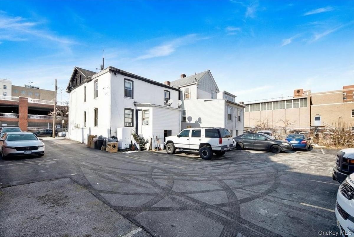 Uncovered parking lot with a residential view