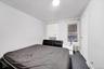 Carpeted bedroom with radiator