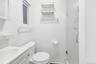 Bathroom featuring a stall shower and vanity
