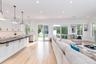 Living area featuring light wood-style flooring, crown molding, and recessed lighting