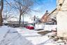 View of yard covered in snow