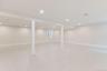 Basement with recessed lighting and baseboards