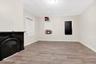 Unfurnished bedroom with light wood-style floors and crown molding