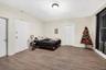 Bedroom featuring light wood-style floors and electric panel