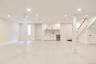 Basement featuring recessed lighting, bar with sink, and wine cooler
