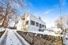 View of snowy exterior with stucco siding