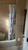 Full bath featuring shower / bath combination with curtain
