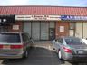 View of commercial location featuring uncovered parking