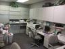 Office space featuring a drop ceiling and built in study area