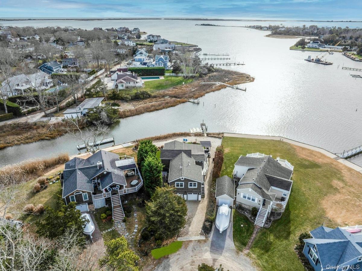 Aerial view of residential area featuring a large body of water