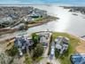 Aerial view of residential area featuring a large body of water