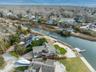 Aerial perspective of suburban area with a large body of water