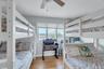Bedroom with light wood-style flooring and ceiling fan
