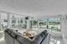 Sunroom / solarium featuring wood ceiling