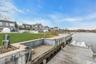 Dock area featuring a yard, a residential view, and a water view