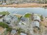 Aerial perspective of suburban area with a large body of water