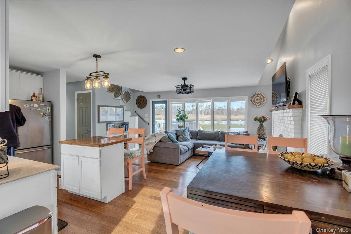 Dining area featuring light wood finished floors and recessed lighting