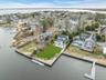 Aerial perspective of suburban area with a large body of water