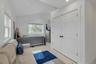 Bedroom featuring lofted ceiling, light wood-style flooring, recessed lighting, and a closet