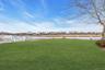 View of green lawn with a water view