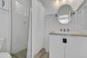 Bathroom with a shower stall and vanity