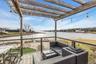 Wooden deck with a water view and an outdoor living space