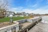 Dock with a yard and a residential view