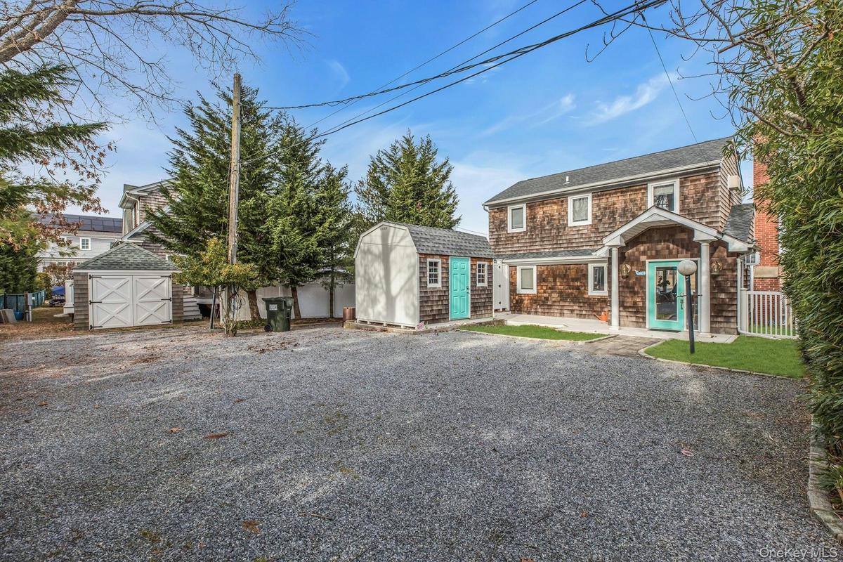 Shingle-style home with a storage unit