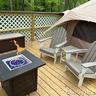 Wooden terrace featuring a fire pit